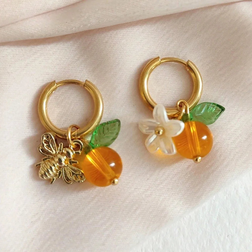 Ringøredobber Bie og appelsinblomst