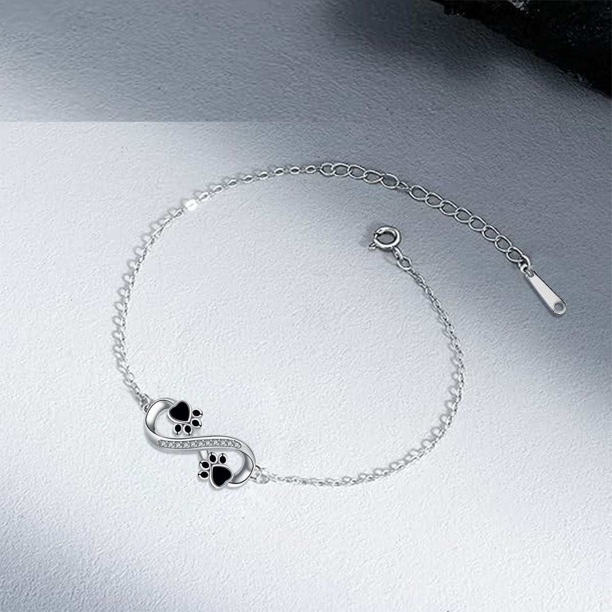Armbånd med potepreg og uendelighetssymbol, med zirkonia